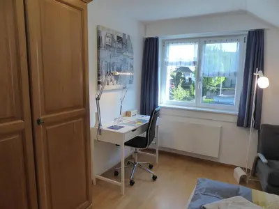 a home office with a desk and a window at 22 – Zimmer & Zmorge in Kreuzlingen