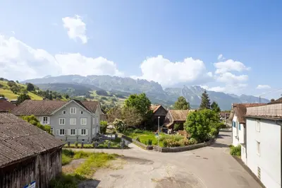a village with mountains in the background at FENUS Apartment mit traumhaftem Bergblick SGT02 in Grabs