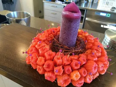 a vase sitting on top of a table with a bunch of fruit at Gasthaus zum Bahnhof in Berg