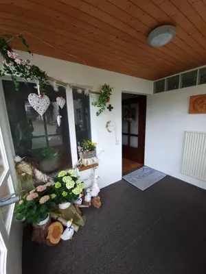 a room with stuffed animals and flowers on the wall at Haus St.Michael in Dozwil