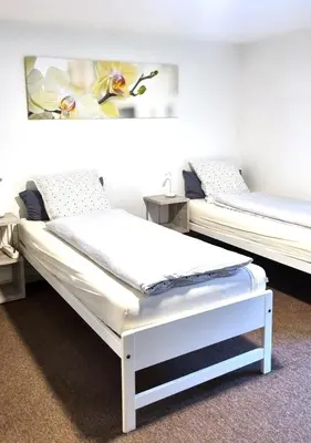 two beds sitting in a room withermottermott at Treffpunkt Heuwiese in Weite