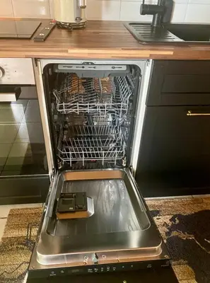 an open oven with a dish rack in it at Ferienwohnung in Stein AR in Stein