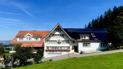 a large white house with a red roof at Hirschen Wald - Gasthaus & Bäckerei in Wald