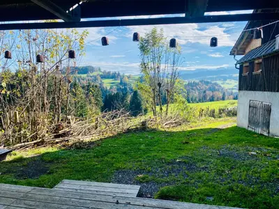 a view from the inside of a building with a view of a field at Birkenhof, Haus Schwänli in Herisau