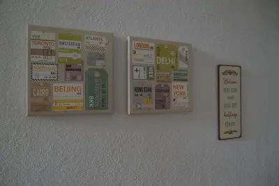 a wall with several stickers on the wall at Villa Donkey BnB in Degersheim
