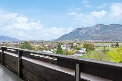 a view of the mountains from a balcony at Sonniges Apartment mit traumhaftem Bergblick in Buchs