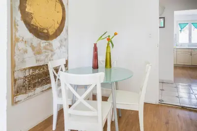 a dining room with a table and chairs at Konstanz nähe, ruhiges 4-Zim-Wohnung bis 8 Personen in Kreuzlingen