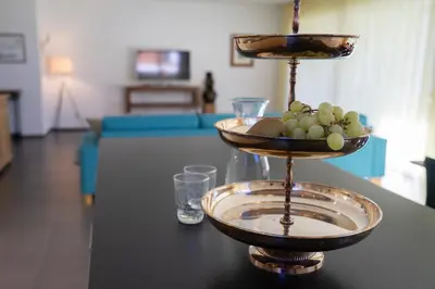 a table with two plates of fruit on top of it at Rietgarten in Wildhaus