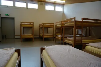 a room with several bunk beds in a room at Jugendherberge Romanshorn in Romanshorn