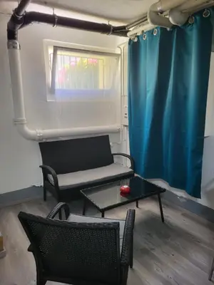 a living room with a couch and a table at Ahornwohnung, ruhige Lage, nähe Bahnhof und Zentrum in Buchs