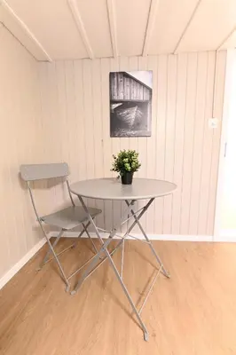 a table and a chair in a room at Alter Zoll in Teufen