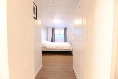 a hallway with a bed in a room at Alter Zoll in Teufen