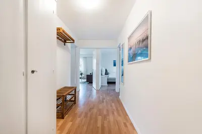 a hallway with white walls and a wooden floor at SOHO 13 !Gratis Parken, Free Parking! in Kreuzlingen