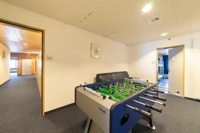 an office with a foosball table in a room at Berggasthaus Oberdorf in Wildhaus