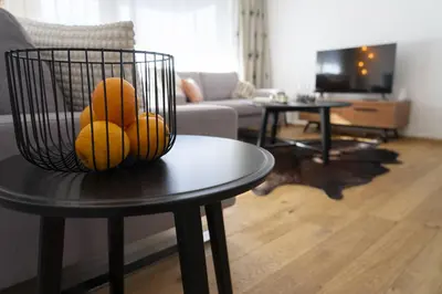 a basket of fruit on a table in a living room at Gamsalpblick in Wildhaus