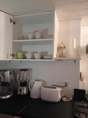 a kitchen with white appliances on a counter at Ferienwohnung in Bühler nähe Appenzell in Bühler