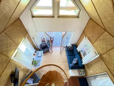 an overhead view of a living room with windows at Ferienhäuschen mit privatem Seezugang in Bottighofen