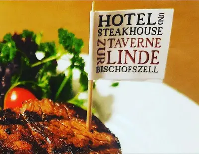 a piece of meat with a sign on top of it at Hotel Taverne zur Linde in Bischofszell