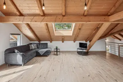 a living room with a couch and a tv at FENUS Grabs Gemütliche Ferienwohnung SGT06 in Grabs