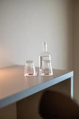 two bottles sitting on top of a table at b_smart motel Amriswil in Amriswil