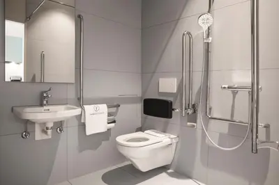 a bathroom with a toilet and a sink and a shower at VISIONAPARTMENTS St Gallen - contactless check-in in St. Gallen