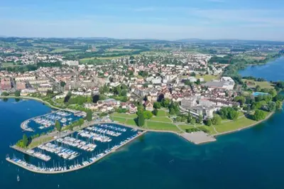 a table on a balcony with a view of a city at Sonniges Bodensee-Balkonidyll in Arbon