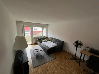 a kitchen with a window with a microwave on a counter at Ferienwohnung am Bodensee in Rorschach