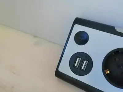 a remote control sitting on top of a table at Tiny House im Grünen in Sankt Margrethen