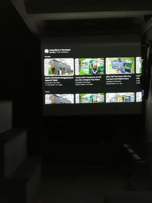 a television screen in a dark room at Tiny House im Grünen in Sankt Margrethen