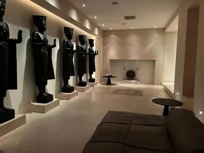 a chandelier with two vases sitting on a table at VILLA Philipp Plein - Designervilla mit Pool & SPA in Amriswil