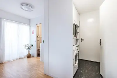 a white room with a washer and dryer at SOHO PENTHOUSE !Gratis Parken, Free Parking! in Kreuzlingen