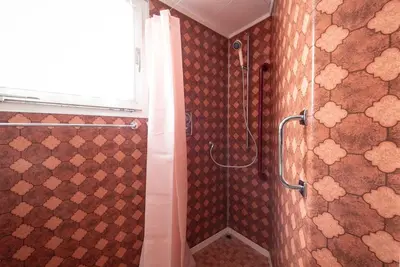 a bathroom with a shower with a shower curtain at 08 - Gästehaus Erika - Hundwil - Appenzellerland in Hundwil