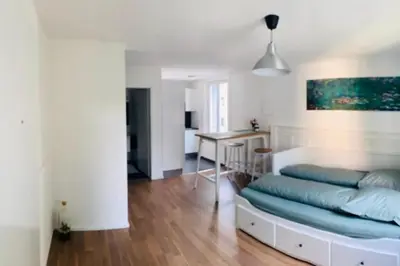 a bedroom with a bed and a desk in a room at Klein aber Fein in Rorschach in Rorschach