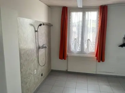 a bathroom with a shower stall and a window at 23 - Gästehaus Erika - Hundwil - Appenzellerland in Hundwil