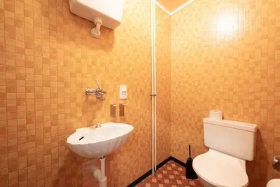 a bathroom with a toilet and a sink at 28 - Gästehaus Erika - Hundwil - Appenzellerland in Hundwil