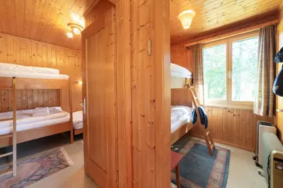a bedroom with two bunk beds in a cabin at Dorea in Wildhaus