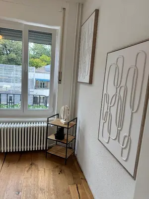 a room with a radiator and a shelf and a window at Apartment im Zentrum St Gallen in St. Gallen