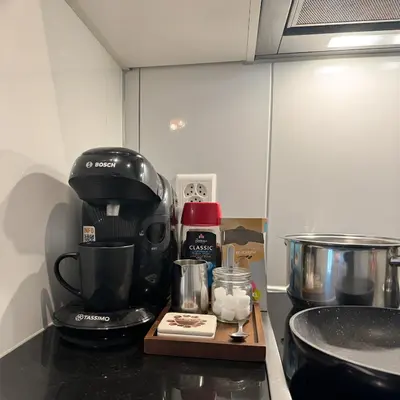 a coffee maker on a counter in a kitchen at Apartment im Zentrum St Gallen in St. Gallen