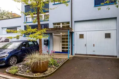 a car parked in front of a building at Nachhaltig Wohnen im 1, Stock, gratis Parkplatz! in St. Gallen