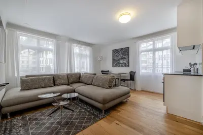a white kitchen with a stove and a sink at Ferienwohnungen Webergasse 23 in St. Gallen