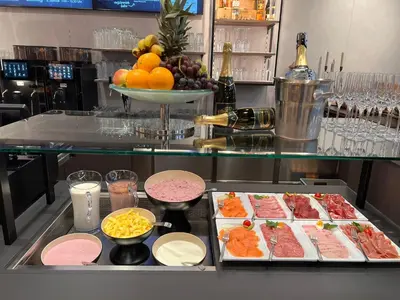 a kitchen with meat and other food items on a counter at Hotel Thurgauerhof Self-Check-in in Weinfelden