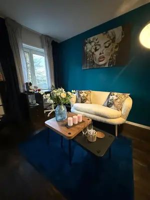 a living room with a couch and a coffee table at Suite Executive Kreuzlingen - MTL Schweiz in Kreuzlingen