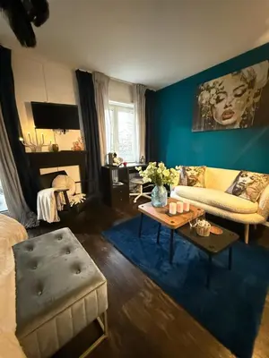 a living room with a couch and a table at Suite Executive Kreuzlingen - MTL Schweiz in Kreuzlingen