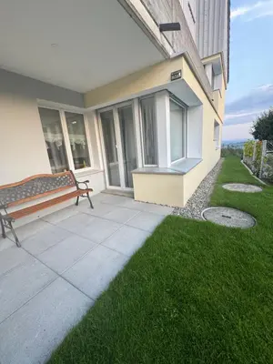 a patio with a bench on the side of a building at 3 Zimmer-Ferienwohnung in der Rüti in Herisau
