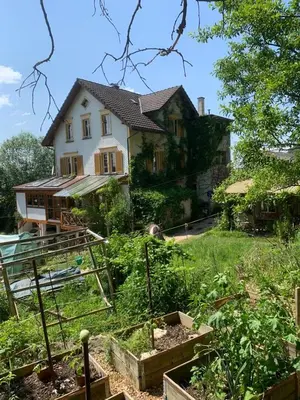 a house with a garden in front of it at Auszeitoase am Wald und Bach in Kradolf