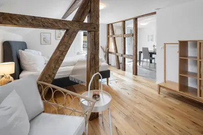 a room with a bed and a couch and a table at Klara 1034 - Olma, Spital, Uni St- Gallen in St. Gallen