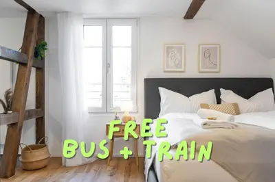 a bedroom with a bed with the words free plus train at Klara 1033 - Olma, Spital, Uni St- Gallen in St. Gallen