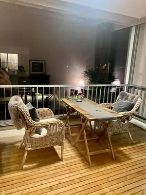 a balcony with a table and chairs on a balcony at Mountain View luxury up to four persons in Diepoldsau