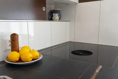 a bowl of lemons on a plate on a kitchen counter at Alpstein in Wildhaus