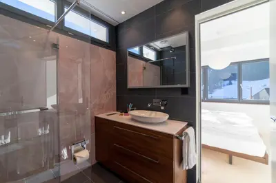 a bathroom with a sink and a shower at Alpstein in Wildhaus